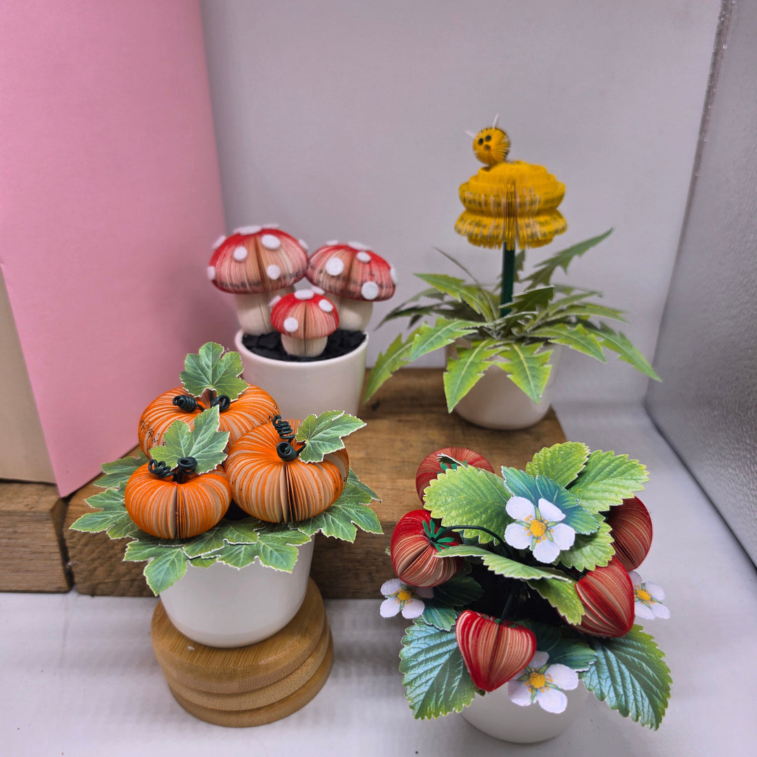 Storybook Garden Collection - four upcycled book art potted plants including toadstools, dandelion, pumpkin patch and strawberry plant