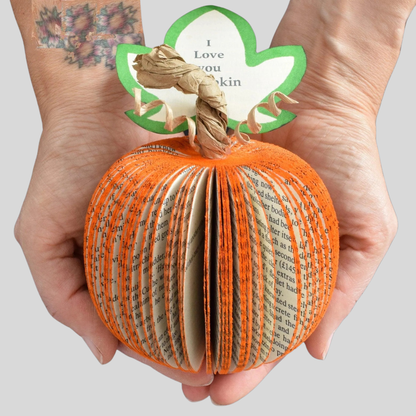 Set of book page pumpkins displayed together as autumn decoration