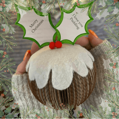Close-up of Hanging Christmas book pudding showing hand-cut book pages