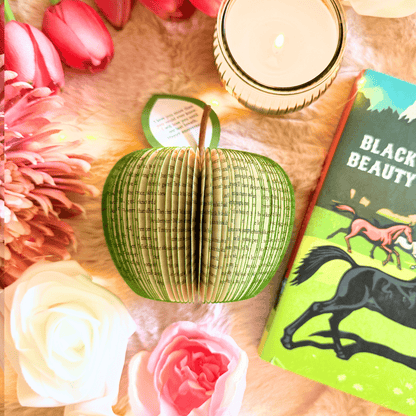 Personalised leaf with custom message on Black Beauty book apple