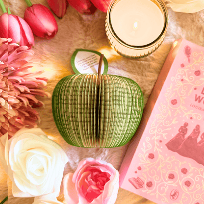 Little Women book apple held in hands to show size, handmade paper anniversary gift