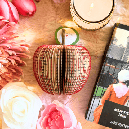 Mansfield Park book apple held in hands to show size, handmade paper anniversary gift