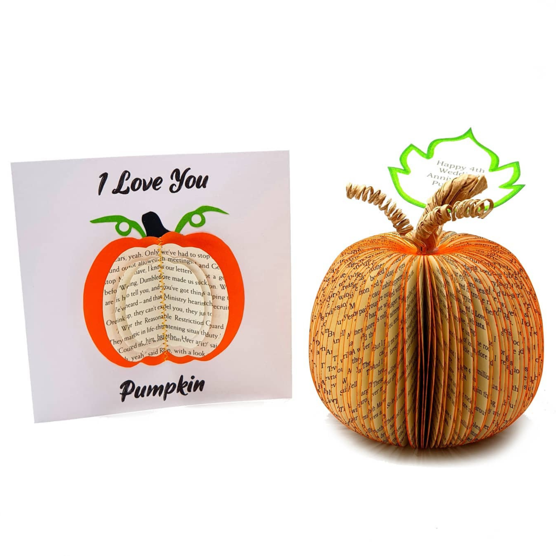 Handmade book page pumpkin displayed in Halloween setting