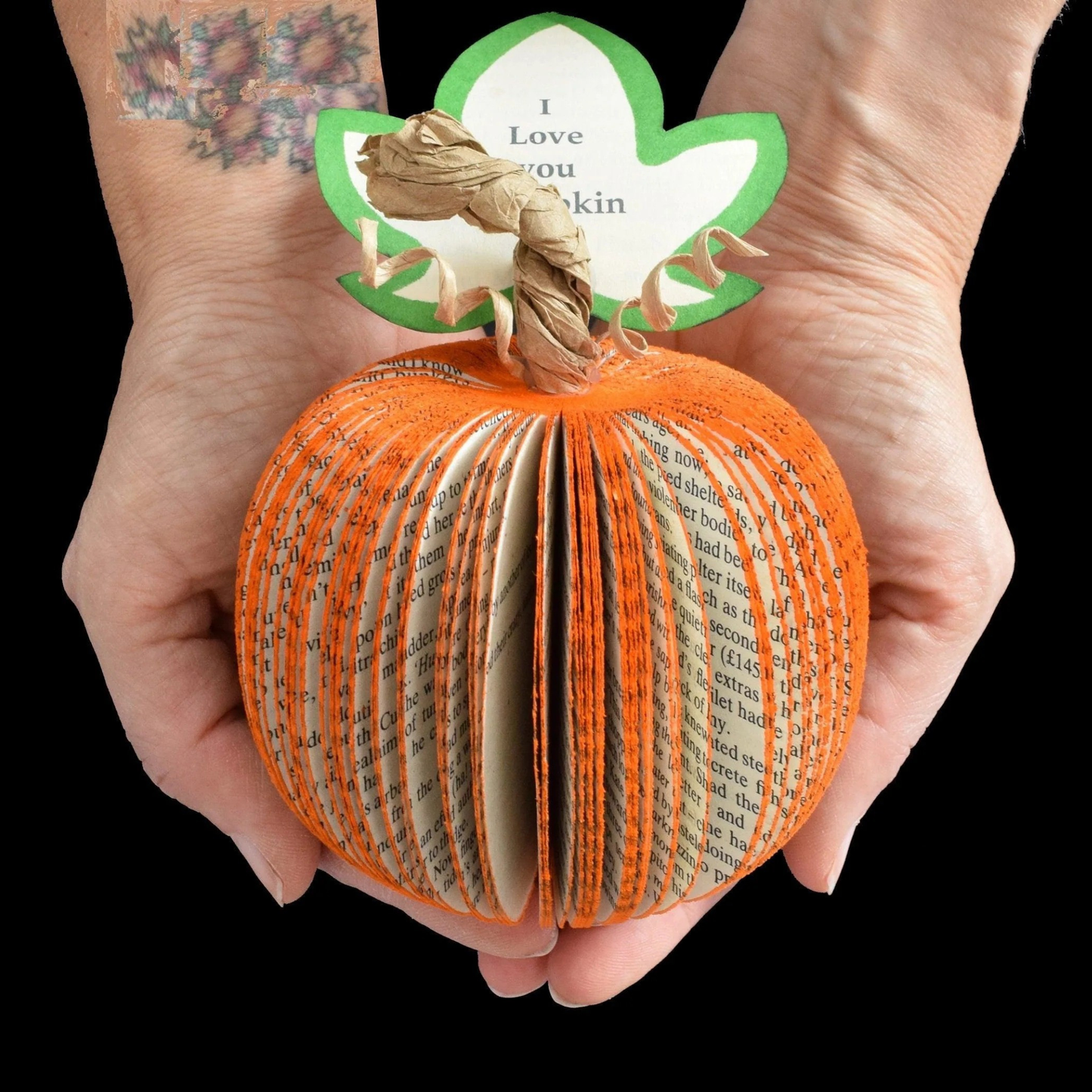 Handmade book pumpkin autumn gift displayed with seasonal props