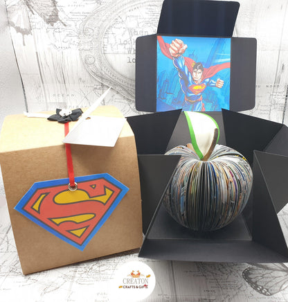 Superman comic book apple displayed beside original comic