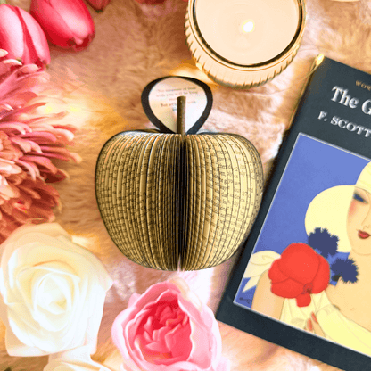 The Great Gatsby book apple held in hands to show size, handmade paper anniversary gift