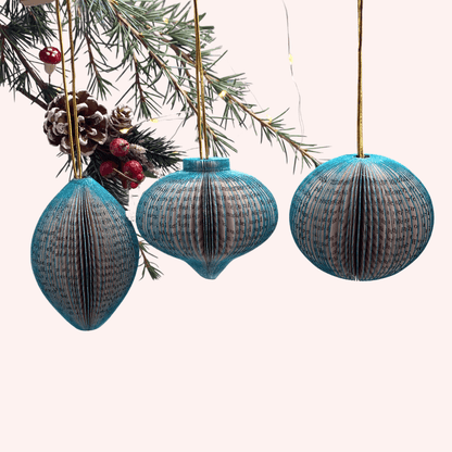 Close-up of Paper Baubles Hanging Decorations showing hand-cut book pages