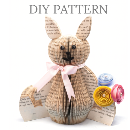 DIY book art rabbit pattern made from folded book pages with ribbon and paper flowers