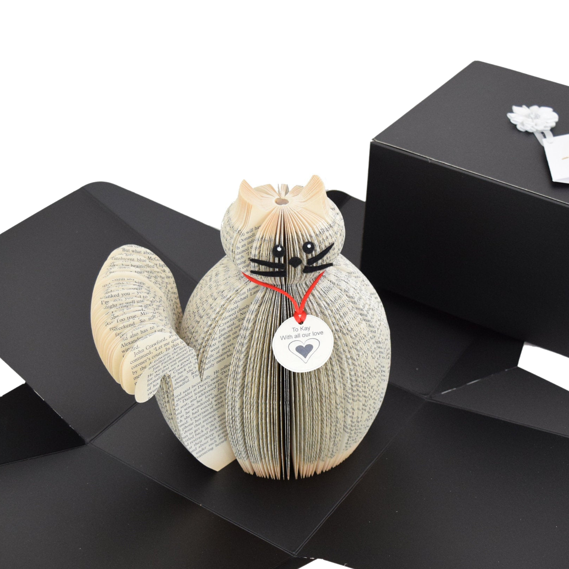 Handmade book page cat presented on a gift box ready for gifting
