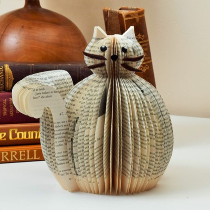 Book page cat displayed as a decorative handmade gift in a home setting
