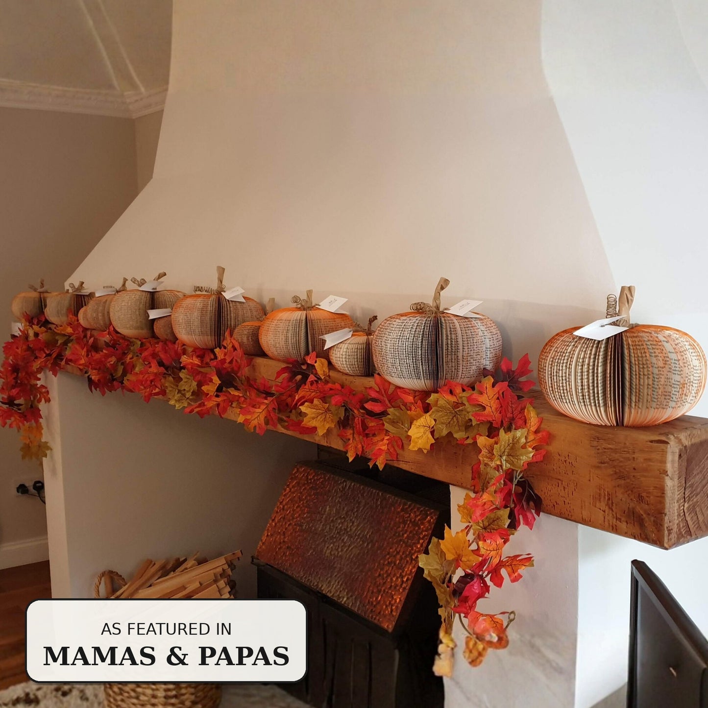 Row of handmade book pumpkins on an autumn mantelpiece display, as featured in Mamas & Papas
