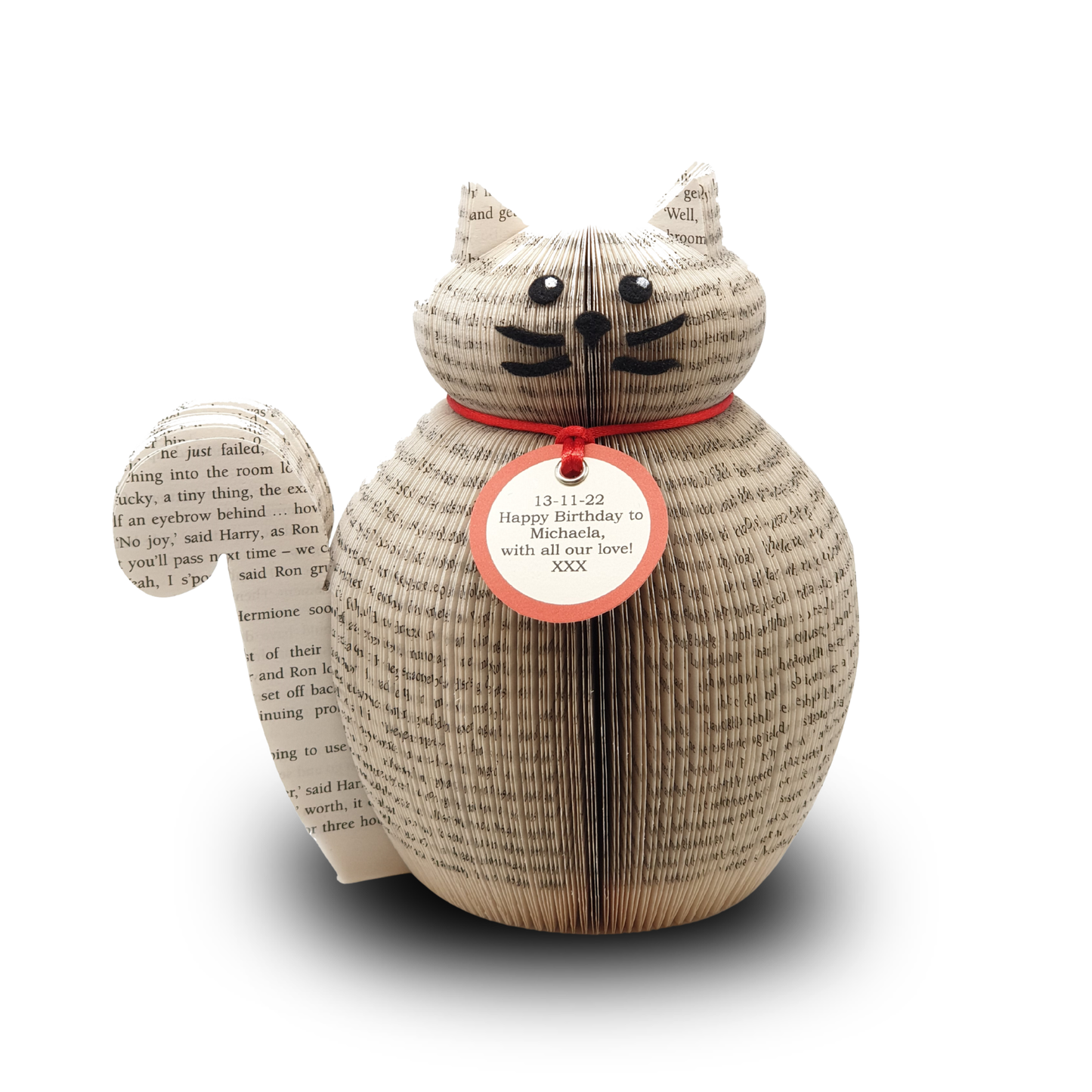 Front view of a handmade cat gift crafted from real book pages