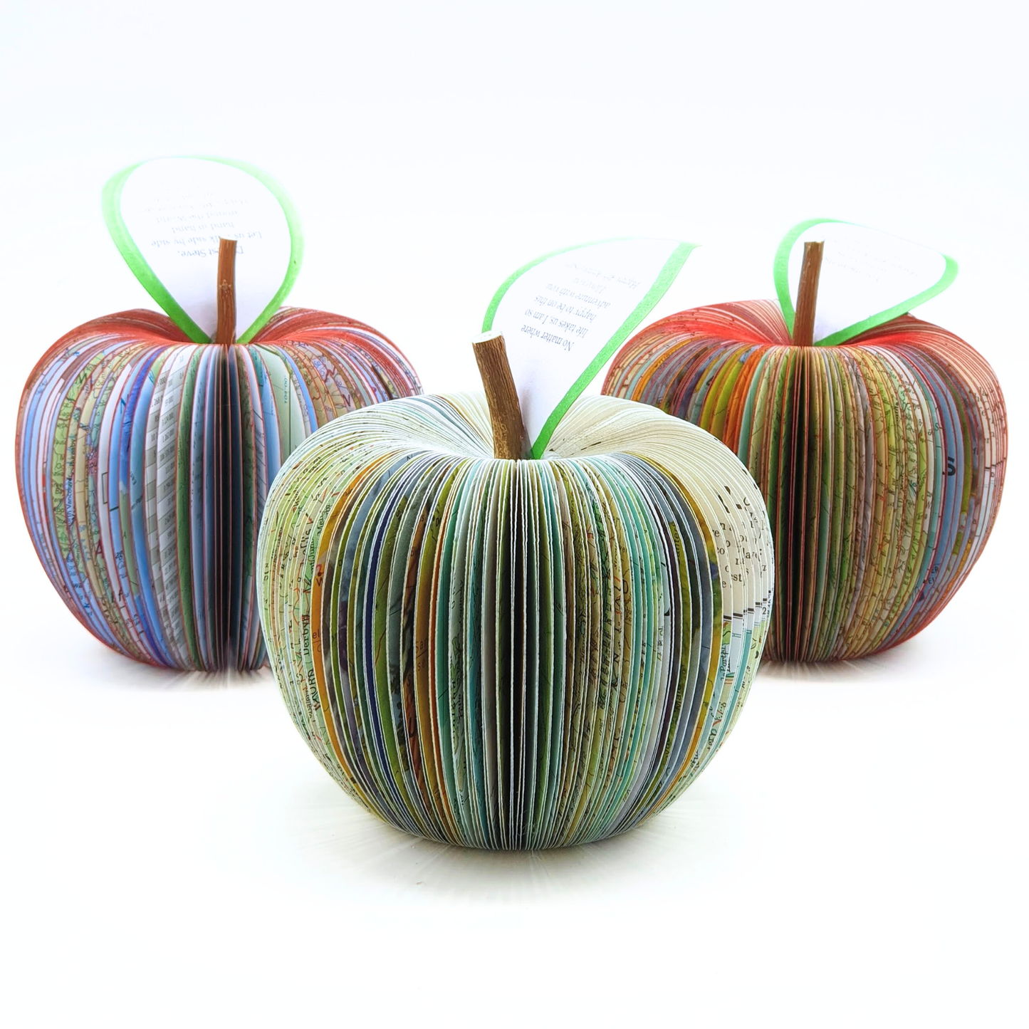 Collection of handmade map apples in different map styles including world atlas and usa road map