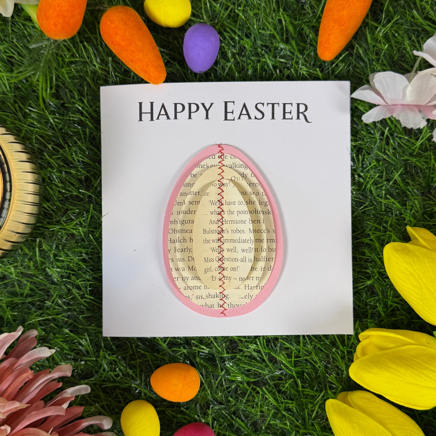 Literary Easter greeting card featuring a stitched egg made from recycled book pages
