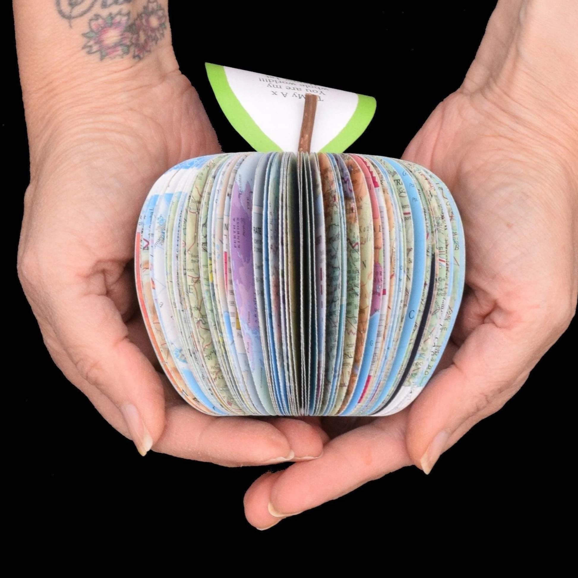 Handmade map apple shown in hands to demonstrate size approximately 9cm keepsake gift