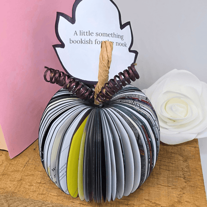 Close-up of Nightmare Before Christmas black pumpkin book gift showing hand-cut book pages and personalised leaf