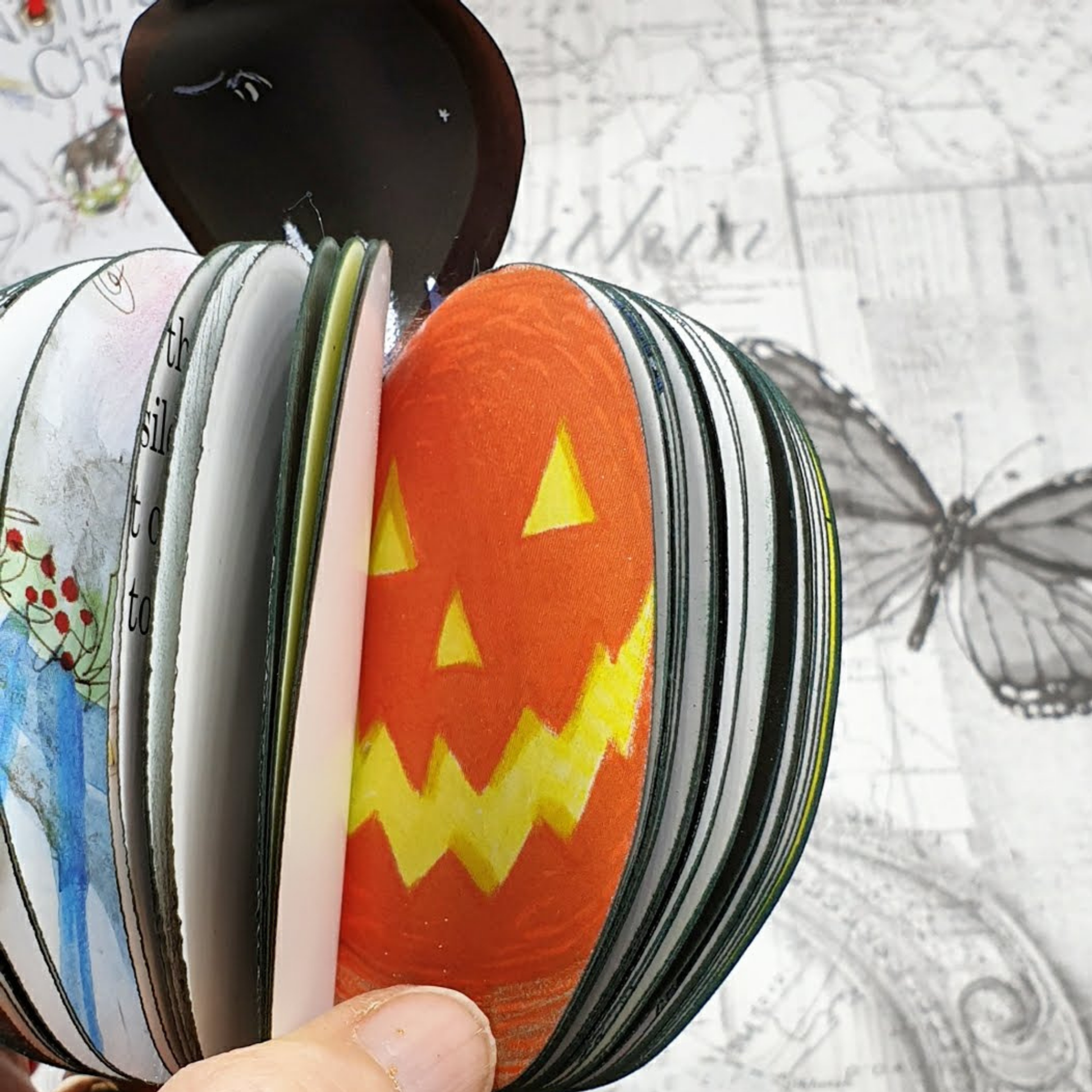 Close-up of Nightmare Before Christmas book apple jack-o-lantern face detail