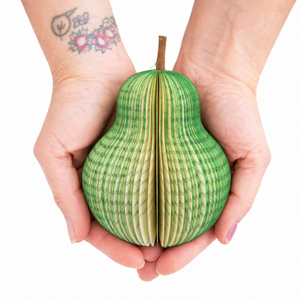 Personalised book pear fruit anniversary gift handmade from reclaimed book pages held in hands