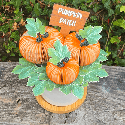 Pumpkin Patch Pot showing all three handmade pumpkins hand-cut from book pages, with pumpkin patch sign and card leaves