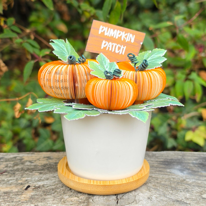 Pumpkin Patch Pot displayed outdoors with a Pumpkin Patch sign, three handmade pumpkins hand-cut from book pages with wired stems
