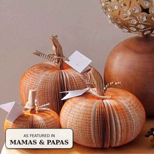 Set of 3 handmade book pumpkins displayed on a table, as featured in Mamas & Papas