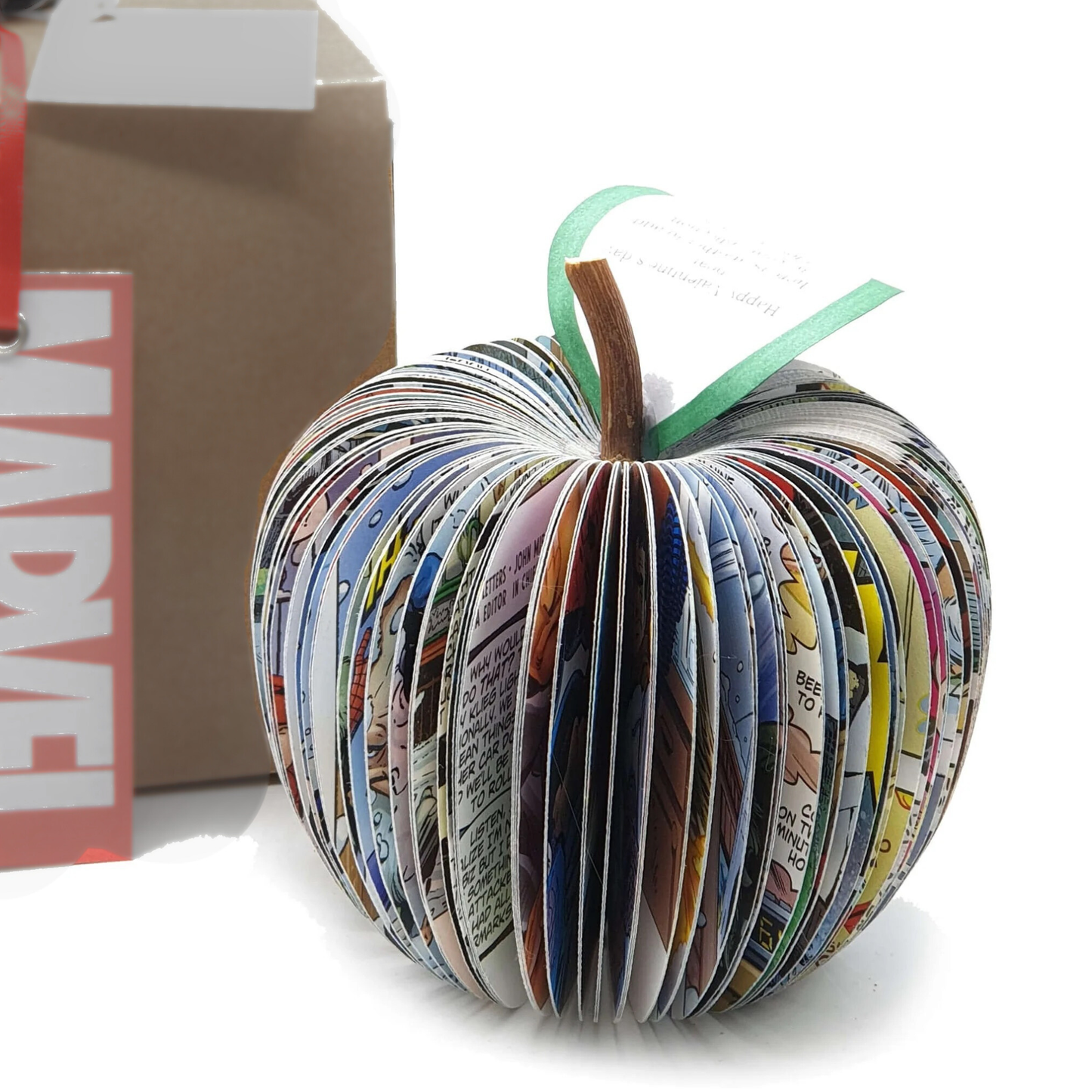 Personalised superhero apple handmade from real Marvel comic book pages shown beside original comic book