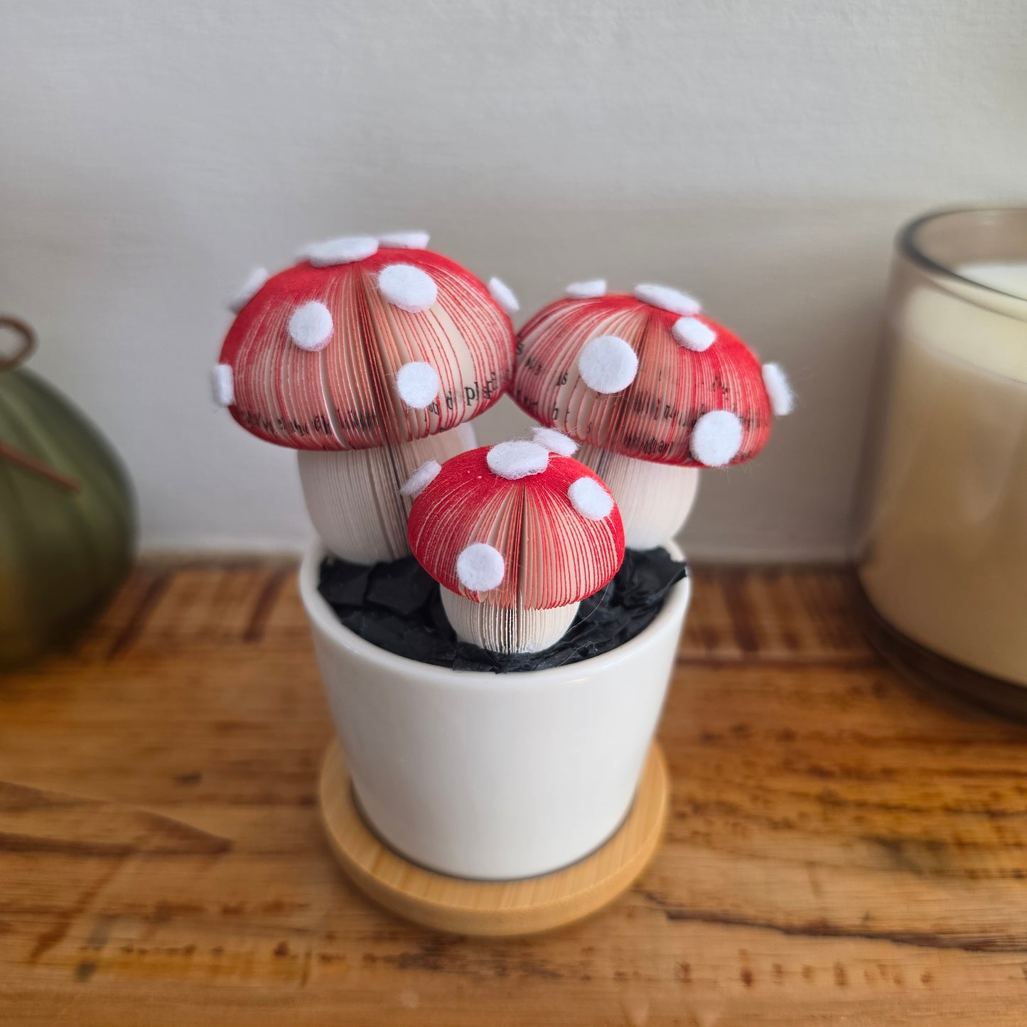Toadstool Trio Pot, three handmade paper toadstools hand-cut from real book pages with felt spots, in a white ceramic pot
