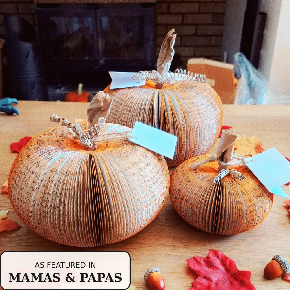 Trio of handmade book pumpkins with gift tags, as featured in Mamas & Papas