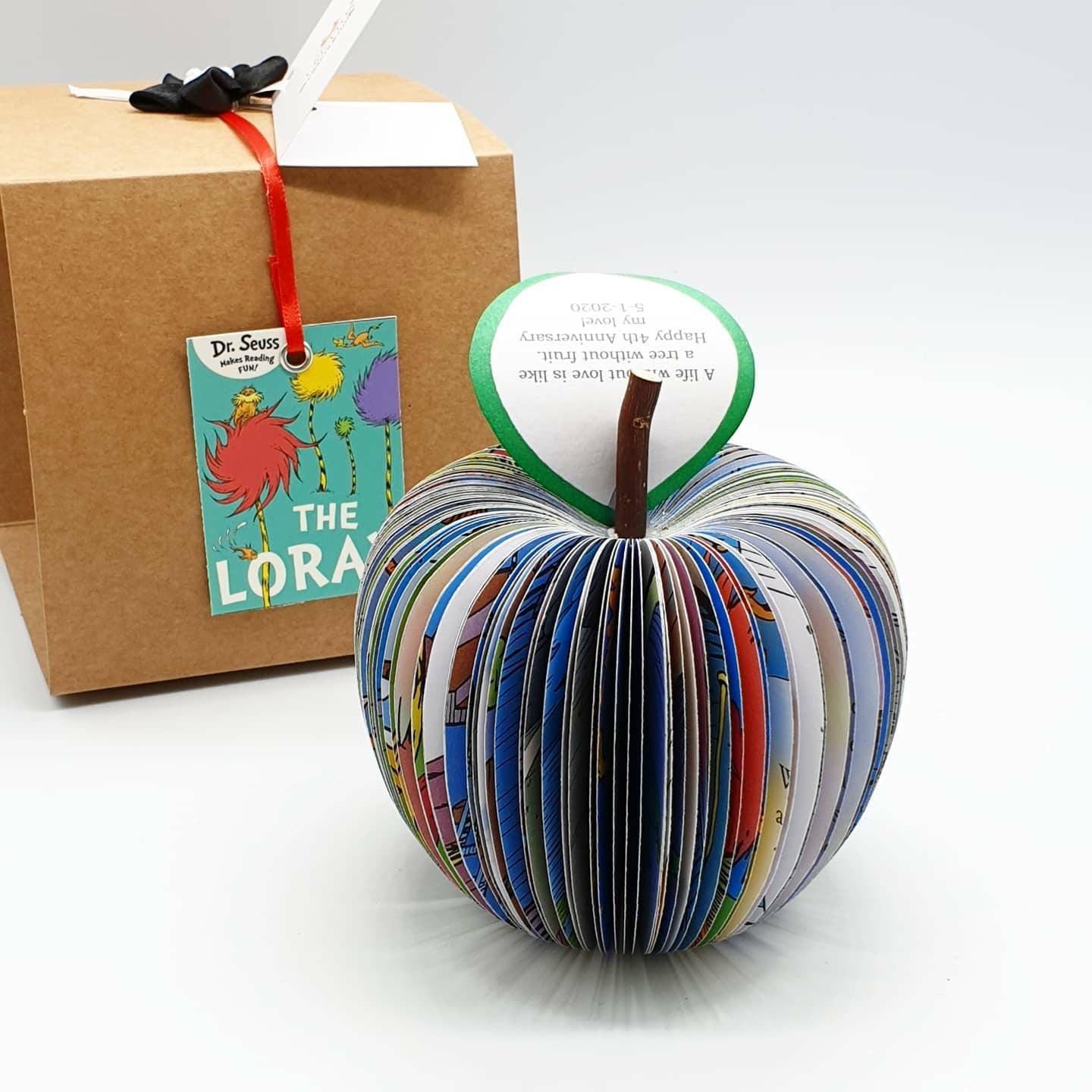 Close up of Dr Seuss book apple showing hand cut book pages, handmade in Northamptonshire