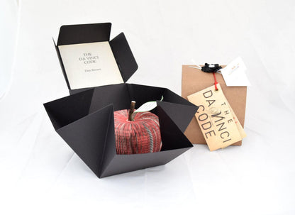 Personalised leaf with custom message on The Da Vinci Code book apple