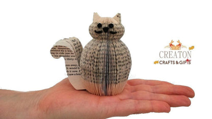 Mini Crookshanks book sculpture held in hands to show size