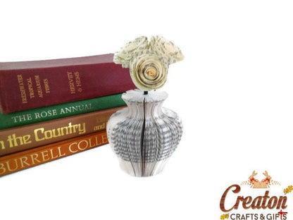 Close-up of Mini Vase and Flowers vase showing hand-cut book page detail