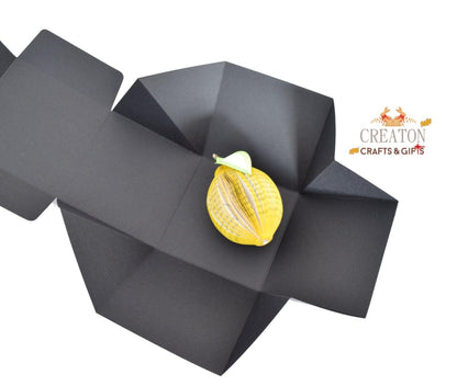 Close-up of Handmade book lemon showing hand-cut book pages detail
