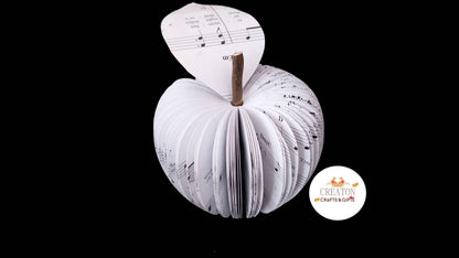 Music book apple displayed beside original book