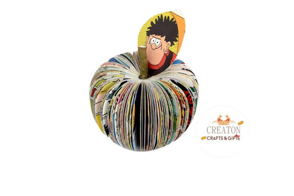 Beano Annual book apple held in hands to show size, handmade paper anniversary gift