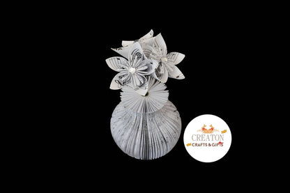 Close-up of Music Vase and Flowers vase showing hand-cut book page detail