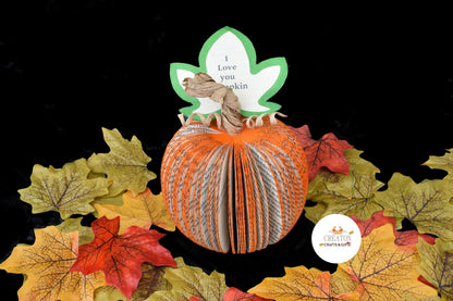 Collection of handmade book page pumpkins in various sizes