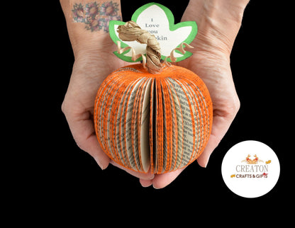 Close-up of handmade book page pumpkin showing hand-cut pages