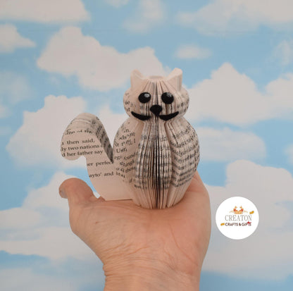 Close-up of Mini Cat showing hand-cut book pages