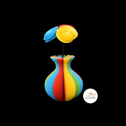 Close-up of Mini Rainbow Vase and Flowers vase showing hand-cut book page detail