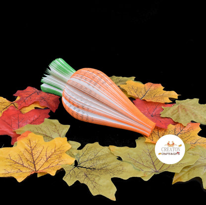 Handmade book page carrot displayed beside original book