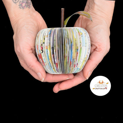 Rupert Annual book apple held in hands to show size, handmade paper anniversary gift
