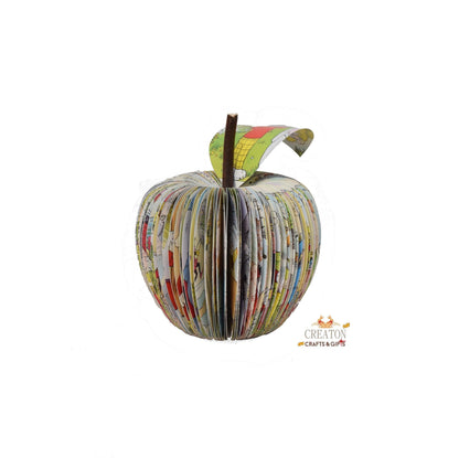 Close-up of Rupert Annual book apple showing hand-cut book pages detail