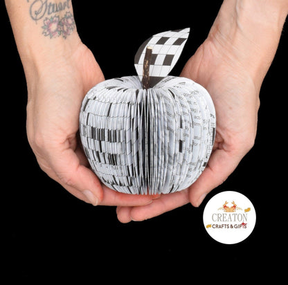 Crossword red book apple held in hands to show size, handmade paper anniversary gift