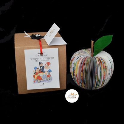 Close-up of Noddy book apple showing hand-cut book pages detail