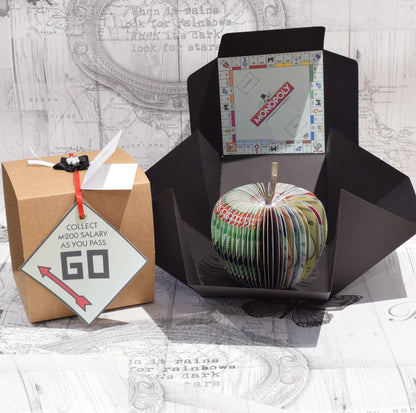 Personalised leaf with custom message on Monopoly Deal book apple