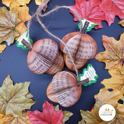 Close-up of Set of 3 Acorn showing hand-cut book pages, handmade teacher gift