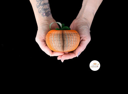 Handmade book persimmon held in hands to show size