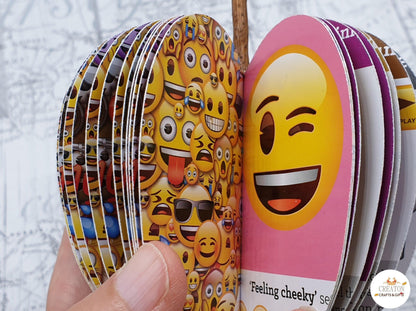 Emoji book apple displayed beside original book
