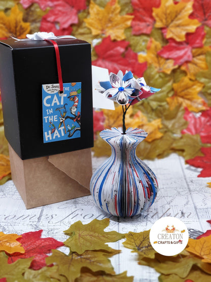 Close-up of Cat in the Hat Book Vase with Origami Flowers vase showing hand-cut book page detail